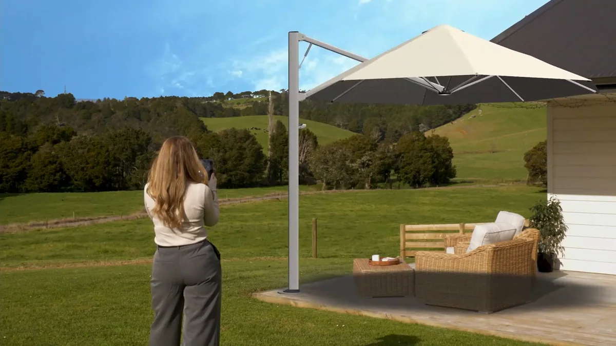 A Shadowspec umbrella placed in a garden with AR